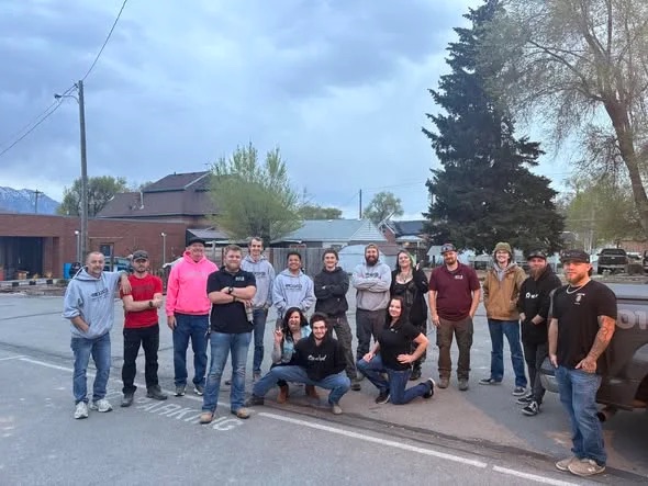 The Quick Quality Plumbing team together outdoors